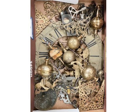 A selection of longcase clock spares inc. finials, chapter ring, spandrels etc 
