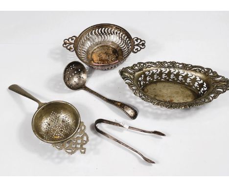 A hallmarked silver pickle fork, pierced hallmarked silver two handled dish, a pair of hallmarked silver sugar tongs, 2.3oz 