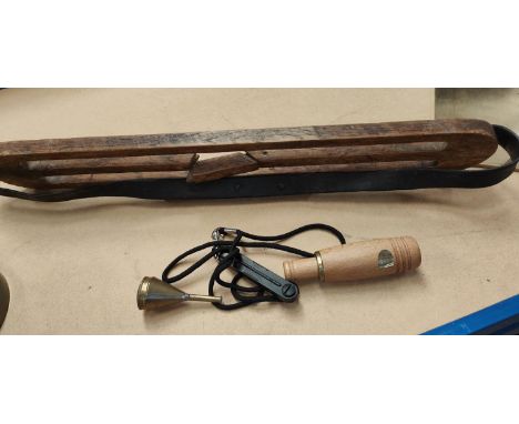 Three duck hunting whistles, one wood and one metal; a desk top magnifier by Hatters &amp; Garnett and another item. 