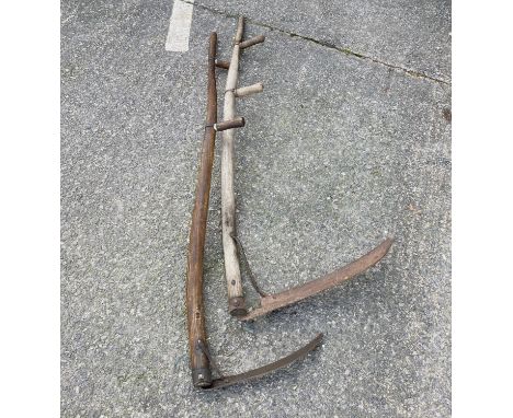 Two vintage wooden field scythes 