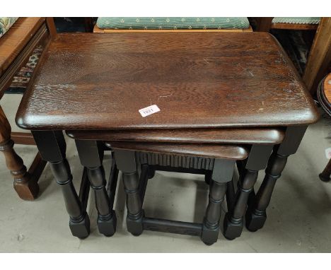 A nest of 3 Ercol oak occasional tables 