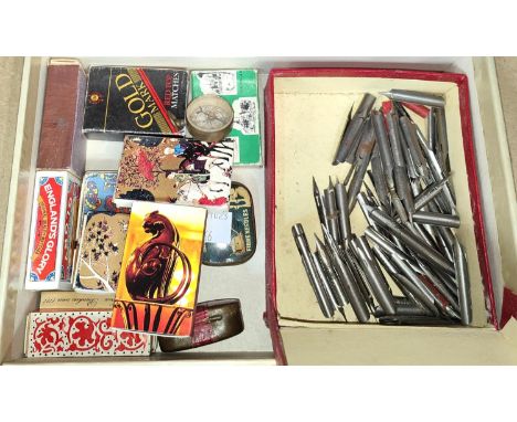 A box of collectables:&nbsp; dip pen nibs; windup gramophone needles; vintage matchboxes; etc. 