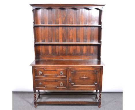 Oak dresser, two shelf delft rack, fitted with a cupboard and two drawers, width 125cm, depth 42cm, height 173cm.