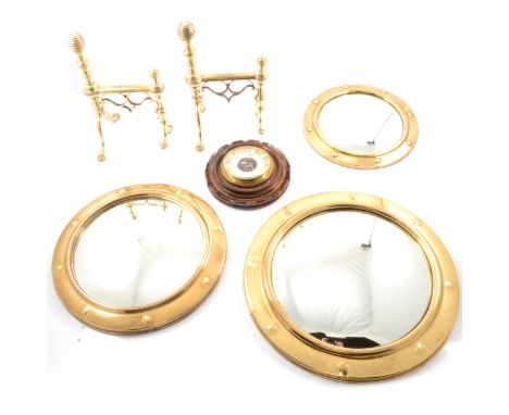Brass convex mirrors, ranging from 26.5cm to 38cm diameter; a pair of brass fire dogs, 27.5cm x 17.5cm; and an oak cased circ