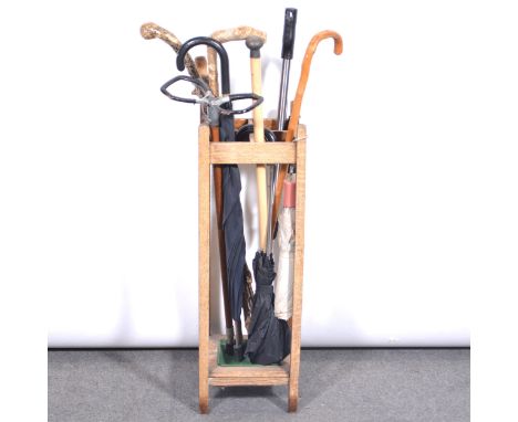 Oak stick stand, and a collection of walking sticks.