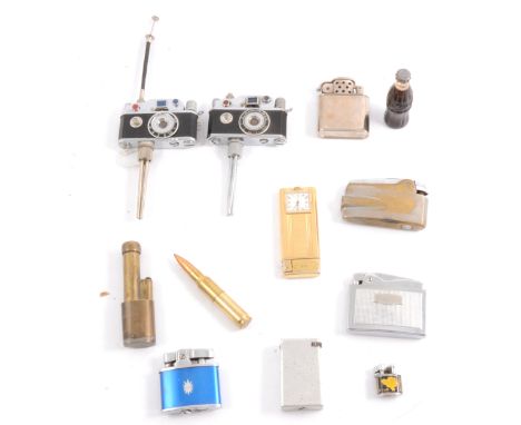 Twelve lighters, including two camera lighters with tripods, two bullet lighters, a Coca Cola lighter, etc.