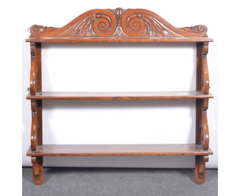 A stained wood three heights wall shelf, carved cresting, 90x90cm.