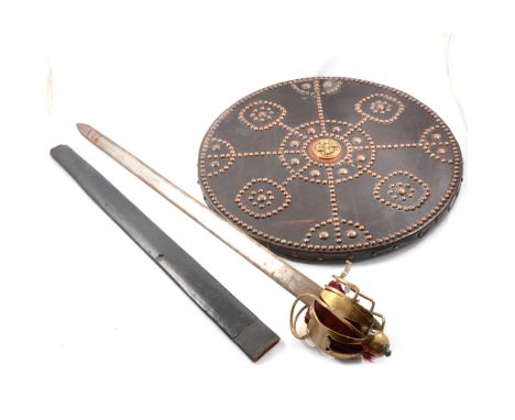 Broadsword with brass basket hilt, blade 71cm, leather scabbard lacking chape; together with a Targe, leather faced with bras