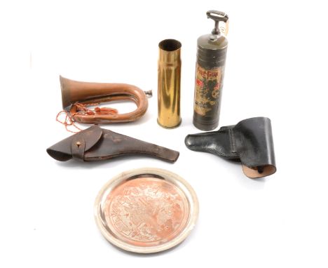 American brass fire extinguisher from a Jeep, a copper bugle, a brass shellcase, two leather pistol holsters, and a brass tra