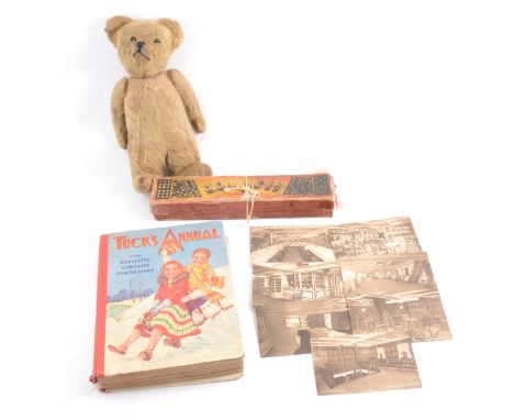 Chad Valley Teddy Bear, 1925 purchased on C.P.S. Montcalm, with button to ear, 31cm, with six postcards of the ship, dominoes