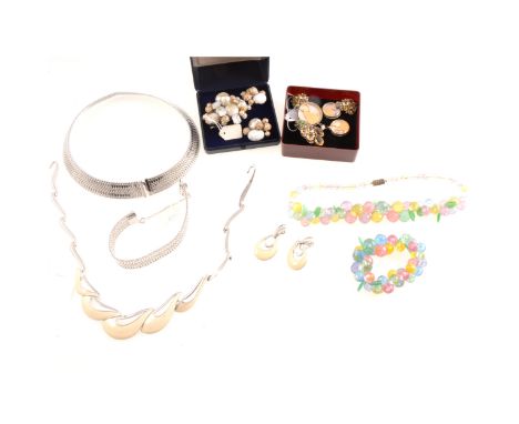 A vintage Trifari necklace and clip on earrings suite, white metal with cream enamel, wave design, necklace 30cm; a Bond Boyd