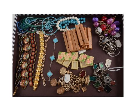 A 1930s German base metal bracelet with twelve pressed glass charms, 19cm; other vintage bracelets with faux malachite, tiger