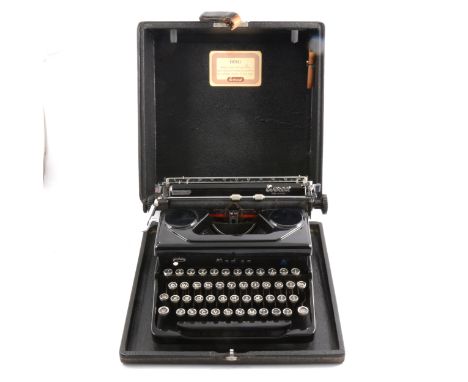An Everest "Mod. 90" portable typewriter, qwerty keyboard, in carry case, 17cm x 35cm x 36cm.