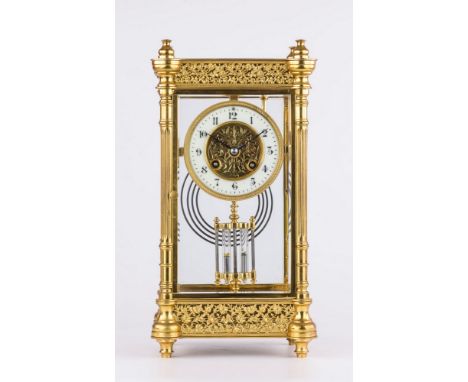 A good French four glass pillar case ormolu mantel clock, early 20th century, the white enamel Arabic chapter ring around a p