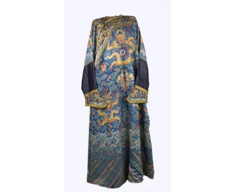 A Chinese silk Mandarin's dragon robe, 18th / 19th century, rampant dragons and worked in couched gilt-wrapped threads surrou