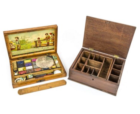A child's pine watercolour paintbox, early 20th century, pine box of shallow rectangular form, the lid lifting to reveal a co