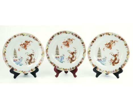 A set of three late 18th century Chinese export plates, polychrome enamel and gilt decoration, with dragon chasing flaming pe