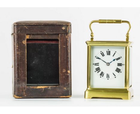 A French gilt brass carriage clock, early 20th century, in squat Corniche case, white enamel Roman dial, bevelled glazed side