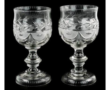 A pair of oversized 19th century wine goblets, the slightly waisted form bowls with comb cut rim above trefoil, raised diamon