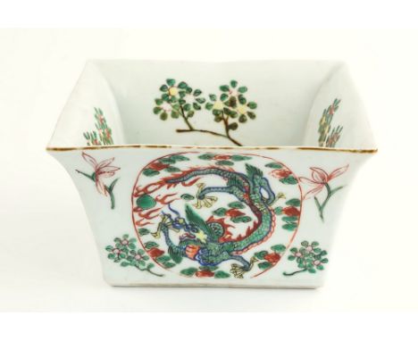 A Chinese famille verte planter, 19th century, of square form with uprising concaved sides to flared rim, the four sides with