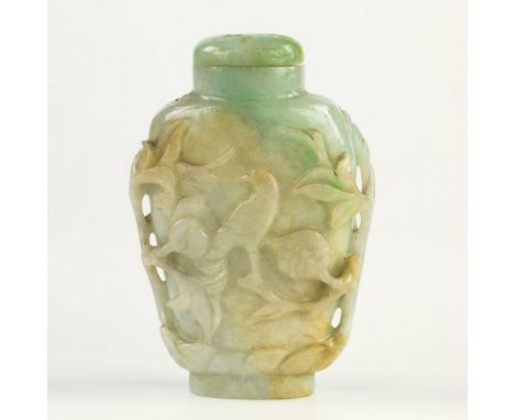 A Chinese carved pale green to white jade snuff bottle, probably early 20th century, one side with a distinct creamy inclusio