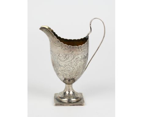 A George III silver helmet shaped cream jug, Jonathan Perkins I and Jonathan Perkins II, London 1795, with scalloped rim, str