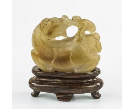 A Chinese pale jade carved miniature figure, 19th / early 20th century, pale grey jade with caramel skin to one side, modelle