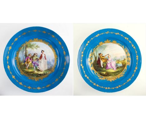 A near pair of 19th century Sevres porcelain chargers, one with incised interlaced Ls mark, the other incised 'G1N', with cel