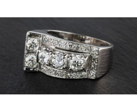 An Art Deco style 18ct white gold and diamond ring, the asymmetric design ring with a central 'T' of five brilliant cut diamo