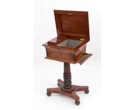 A Regency mahogany teapoy, circa 1815, the hinged lid with stepped moulded edge over a concave sarcophagus body, the interior