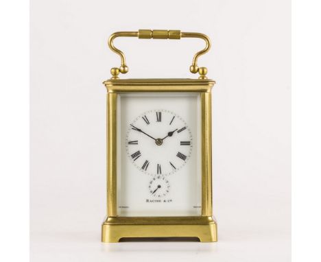 A gilt brass carriage clock with alarm signed 'Racine & Co.', late 19th century, four bevelled glass panelled obis case, oval