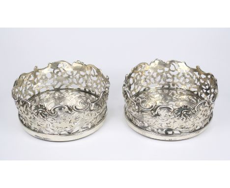 A fine pair of early Victorian silver wine coasters with silver bases, John Angell II and George Angell, London 1838, the sil
