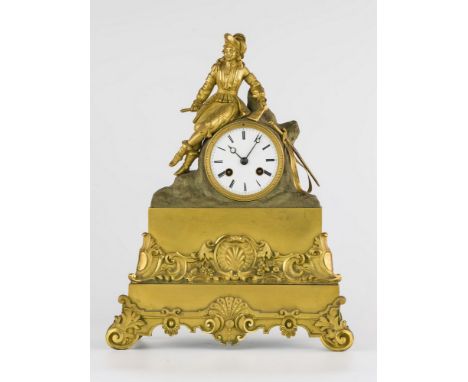 A French gilt brass figural mantle clock, circa 1850, the case with a finely dressed cavalier resting upon a naturalistic set