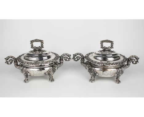 A good pair of mid-19th century Sheffield plated small covered tureens, oval bombe form with floral and foliate borders, twin