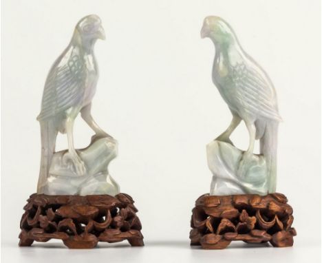 A pair of Chinese carved pale jade birds, probably early 20th century, archaic style carving in pale lavender-grey with some 