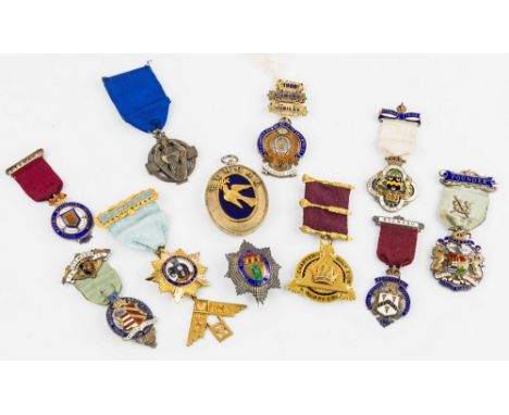 A collection of silver and silver-gilt Masonic jewels, first half 20th century, including a silver gilt and enamel oval 'Beng