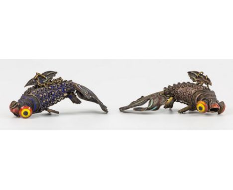 A pair of Oriental white metal and enamel articulated fish, mid-20th century, the fan tail fish with articulated scaled bodie