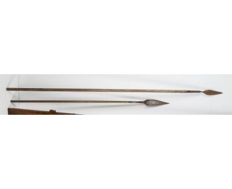 An African tribal spear, 19th century, hand forged foliate form tip with coiled metal collar, 73¼in. (185.4cm.) long; togethe