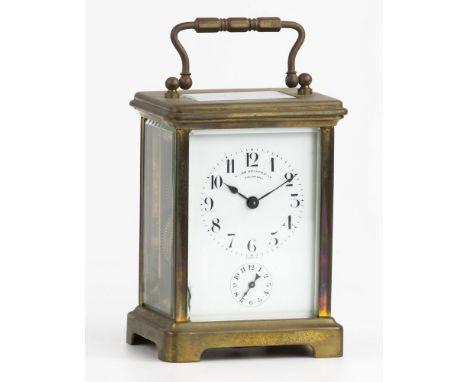 A French brass cased carriage clock with alarm, the Arabic enamel dial signed by the retailer, R. Van Reuben & Co., Savannah,