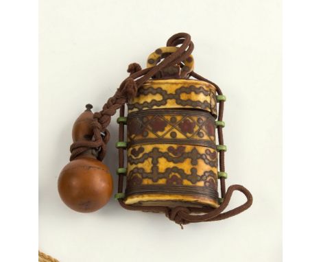 A Japanese bone inro, 19th century, of rounded rectangular form comprising two graduated lidded compartments, exterior with t
