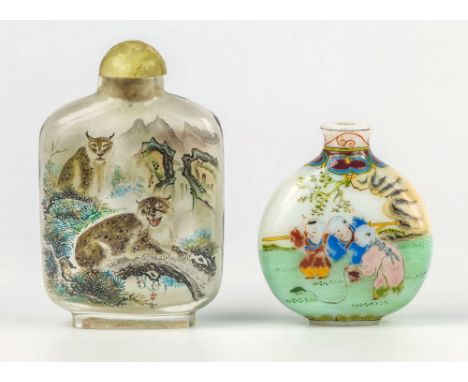 A Chinese interior painted glass snuff bottle, rectangular form, with painted decoration of two wild cats in mountainous terr