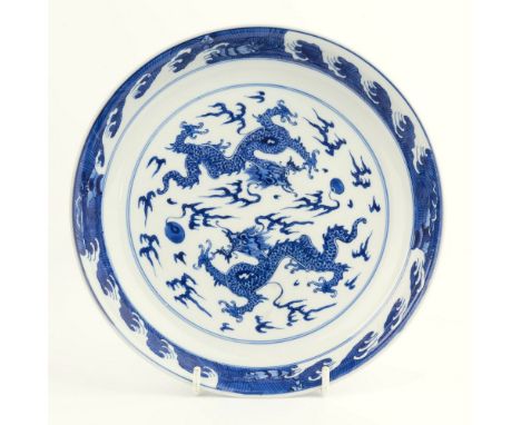 A Kangxi period Chinese blue and white ceramic saucer dish, six character Kangxi mark (1662-1722) and of the period, decorate
