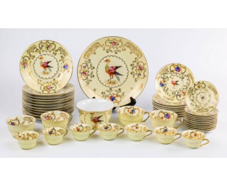 A Continental part tea and coffee service, early 20th century, decorated with a hoho bird within a border of gilded cartouche