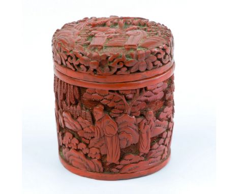 A Chinese cinnabar lacquer jar with cover, early 20th century, cylindrical form decorated with various figures in garden sett