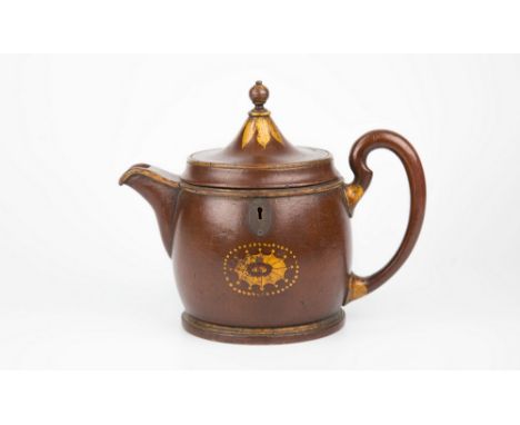 An extremely rare painted wood teapot form tea caddy, early 19th century, oval form, parcel gilt decoration with a fan patera