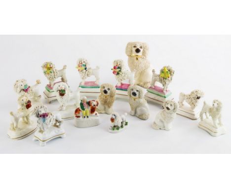 A collection of 19th century Staffordshire and other miniature poodles and dogs, to include a pair and two single poodles wit