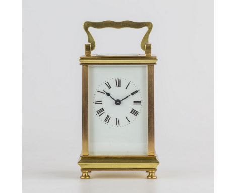 A brass cased carriage clock, early 20th century, in typical Anglaise case surmounted with serpentine handle, single train mo