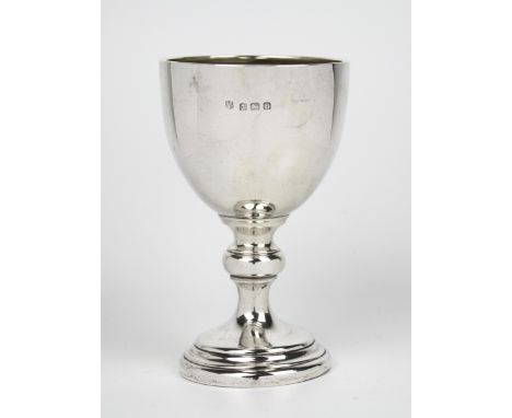 A George V silver goblet, William Neale, Birmingham 1932, the round funnel bowl with inverted rim, on knopped stem with stepp