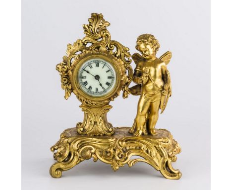 A rococo gilt metal Louis XV style mantel clock, late 19th century, by the Ansonia Clock Co., signed to 52mm. Roman enamel di