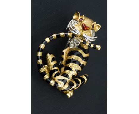 An 18ct gold, enamel, diamond and ruby tiger brooch by Asprey, in yellow and white gold with black enamel stripes and red tra